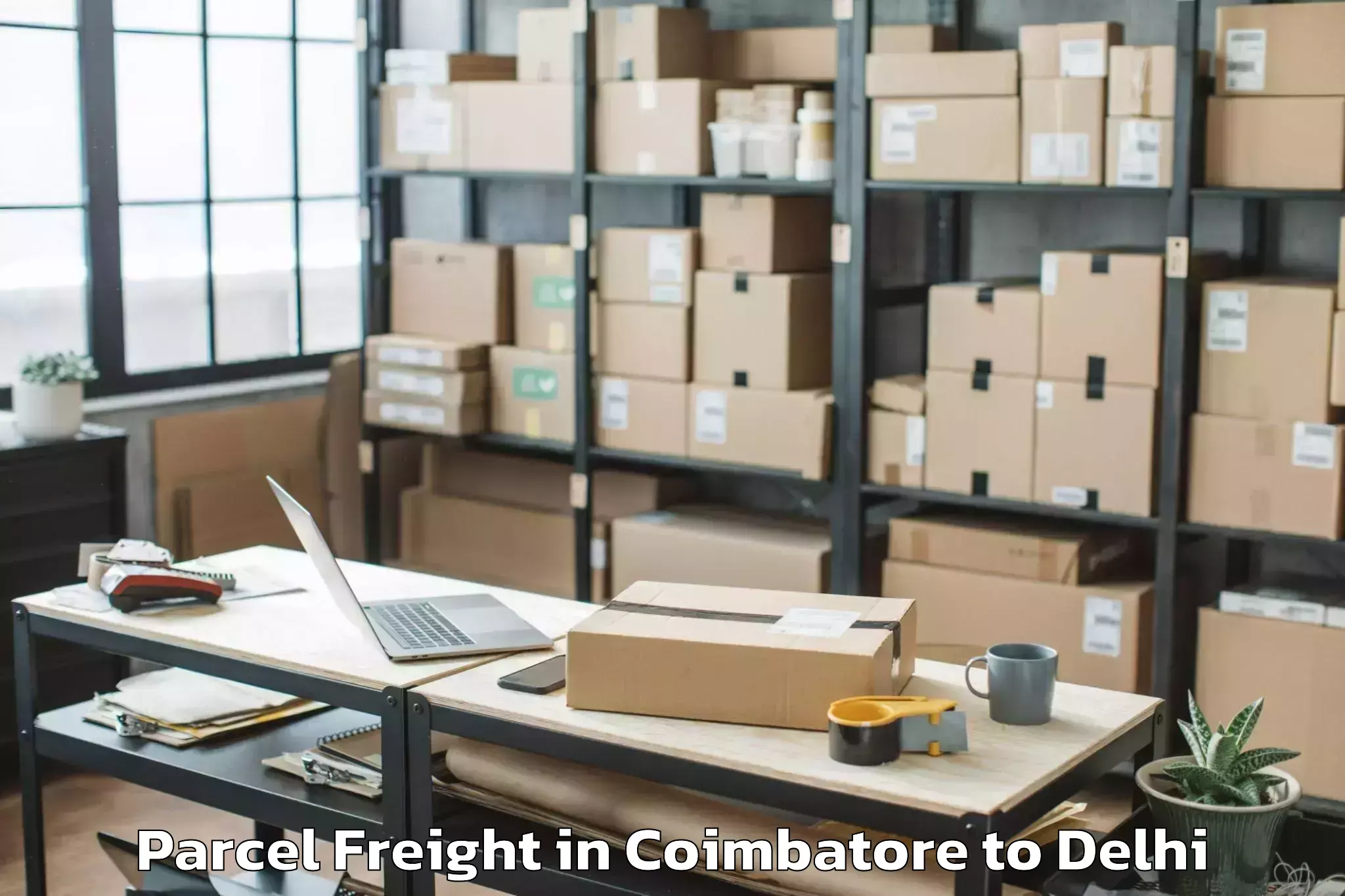 Book Your Coimbatore to Burari Parcel Freight Today